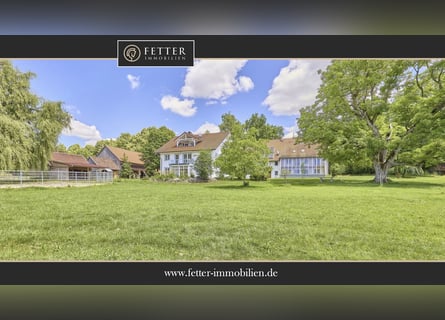 Private equestrian property in Ravensburg district featuring multiple residential buildings and lake
