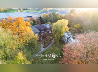 Propriété exclusive avec villa, centre équestre et complexe couvert située au bord d’un lac privé à 