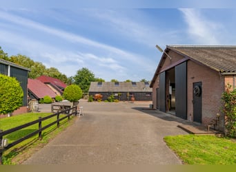 Country estate with equestrian facilities including an indoor riding arena, outdoor riding arena, an