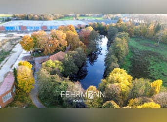 Exclusive estate with a villa, riding facilities, and an indoor arena complex located by a private l