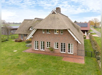 Exclusive estate with approximately 460 sqm of living space, stables, riding arena, outbuildings, an