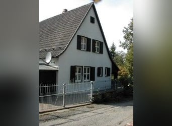 House with stable, round pen, and riding arena in a quiet outskirts location