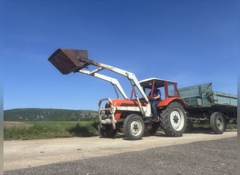 Steyr Traktor T190 mit Schaufel und Mistgabel