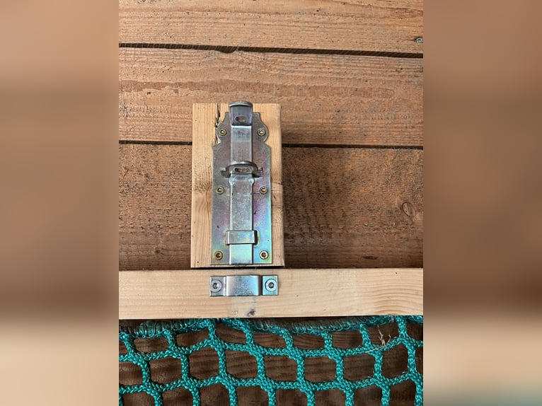 Wall-mounted hay net