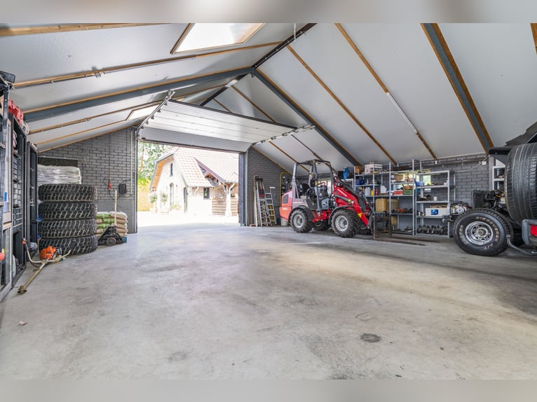 Country estate with equestrian facilities including an indoor riding arena, outdoor riding arena, an