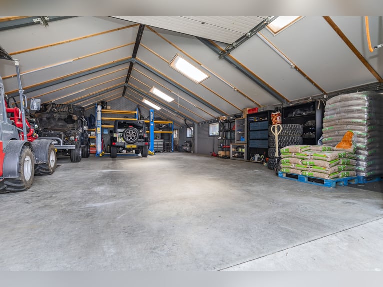 Country estate with equestrian facilities including an indoor riding arena, outdoor riding arena, an