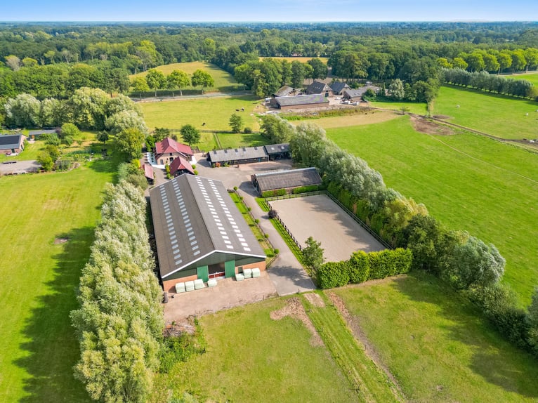 Country estate with equestrian facilities including an indoor riding arena, outdoor riding arena, an