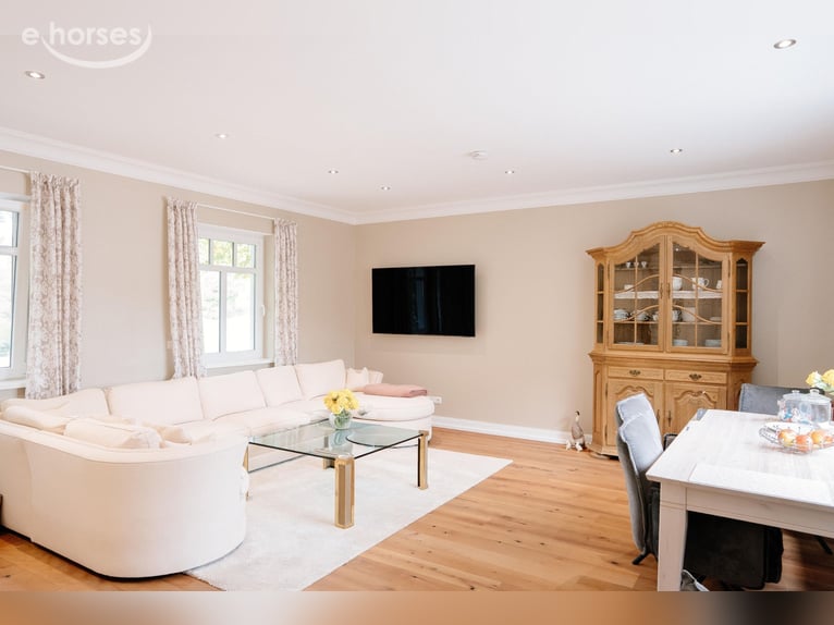 Exclusive equestrian facility with a detached house and two residential/guest houses on approximatel