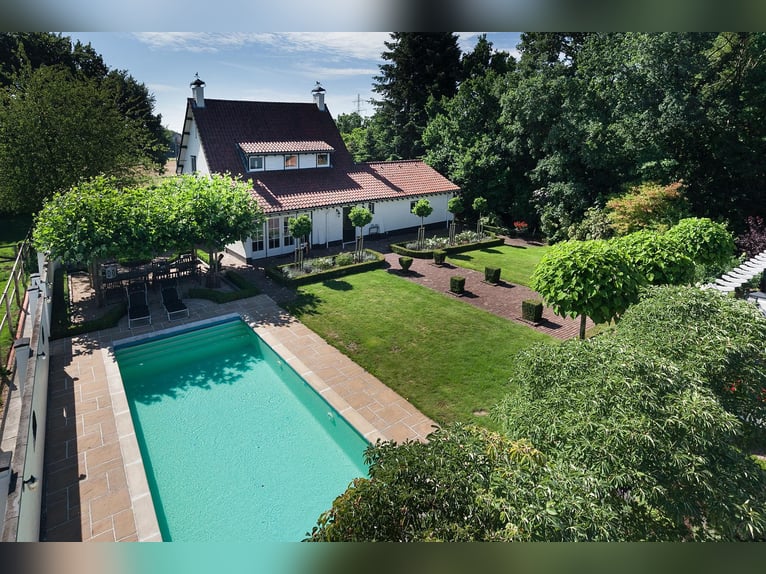 Exquisite private equestrian estate featuring an indoor arena, stables, and a luxurious residence