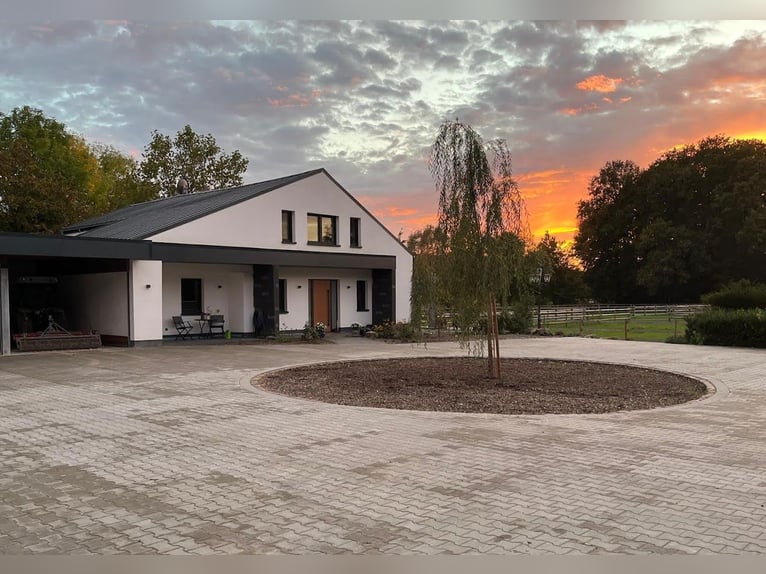 Private riding facility – recently renovated, including an indoor arena, large outdoor sand school, 