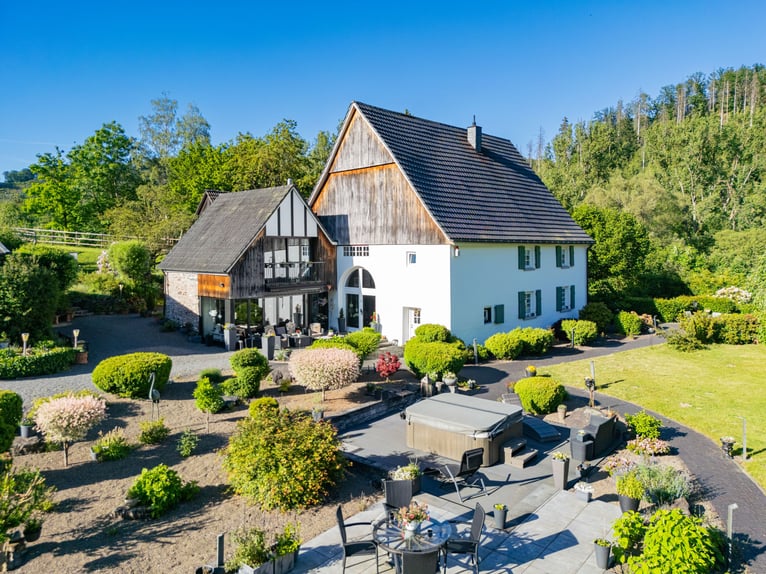 Private riding facility with a historic residential building in a picturesque setting