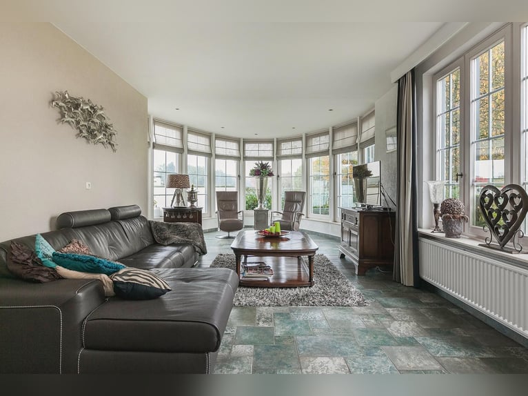 Exquisite private equestrian estate with Indoor arena, stables, and luxurious residence