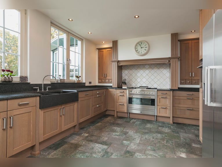 Exquisite private equestrian estate with Indoor arena, stables, and luxurious residence