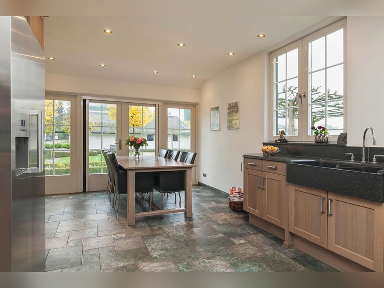 Exquisite private equestrian estate with Indoor arena, stables, and luxurious residence